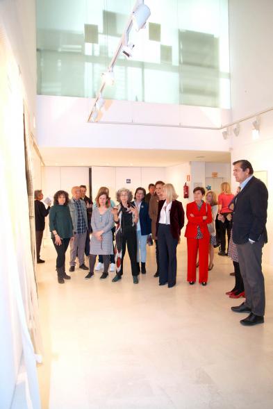 visitantes a la Exposición. 