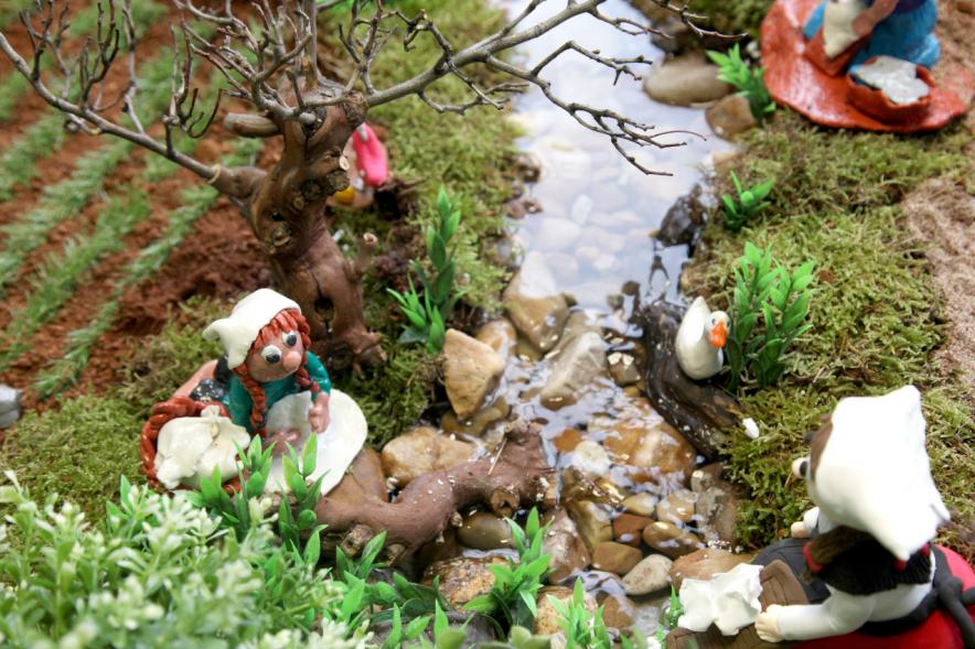 Mujeres lavando en el río
