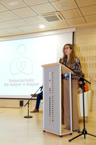 detalle, plano medio cuerpo, participante a la Presentación del Programa de Voluntariado 